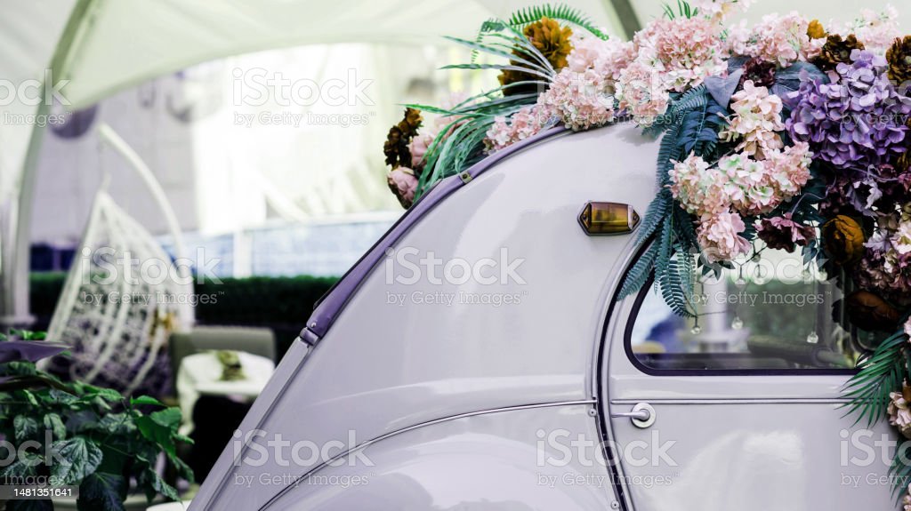 old vintage car decorated with flowers. automobile with wedding decoration